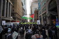 Protestors for Gaza gather outside a downtown hotel in Toronto the planned location of an event for Prime Minister Justin Trudeau, Friday, March 15, 2024. &nbsp;Pro-Palestinian groups are alleging Toronto officers are selectively policing at their organized protests after three males were arrested then released and three others were charged during a demonstration on Saturday. THE CANADIAN PRESS/Cole Burston