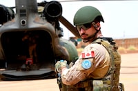 (FILES) In this file photo taken on August 01, 2018 a Canadian United Nations soldier prepares to move out of a base in Gao on August 1, 2018, to take part in an operation during the United Nations Multidimensional Integrated Stabilization Mission in Mali (MINUSMA). - Canadian personnel participating in the UN peacekeeping force in Mali will remain in place until the end of August, a month longer than planned, to ensure a smooth transition, the government said June 14, 2019. (Photo by SEYLLOU / AFP)SEYLLOU/AFP/Getty Images