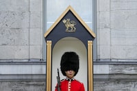 Ceremonial Guard Cpl. Yeomans of the Canadian Grenadier Guards regiment performs his Sentry Duties at Rideau Hall, in Ottawa on Friday, July 7, 2023. THE CANADIAN PRESS/Sean Kilpatrick