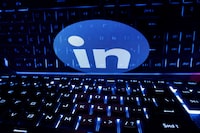 FILE PHOTO: A keyboard is placed in front of a displayed LinkedIn logo in this illustration taken February 21, 2023. REUTERS/Dado Ruvic/Illustration/File Photo