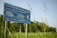 A government sign indicating entry into the Duffins Rouge Agricultural Preserve, in Pickering, Ont., Monday, June 19, 2023. (Christopher Katsarov/The Globe and Mail)