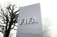 FILE PHOTO: FIFA's logo is seen in front of its headquarters during a foggy autumn day in Zurich, Switzerland November 18, 2020. REUTERS/Arnd Wiegmann