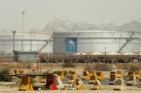 FILE - Storage tanks are seen at the North Jiddah bulk plant, an Aramco oil facility, in Jiddah, Saudi Arabia, on March 21, 2021. Saudi Arabia's state-run oil giant Aramcobrought in $30 billion in revenues in the second quarter of 2023, a nearly 40% decline from the same period the previous year, which it attributed to lower crude oil prices. (AP Photo/Amr Nabil, File)