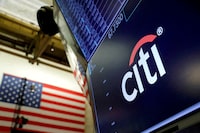 FILE PHOTO: The logo for Citibank is seen on the trading floor at the New York Stock Exchange (NYSE) in Manhattan, New York City, U.S., August 3, 2021. REUTERS/Andrew Kelly/File Photo