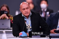 (FILES) Tuvalu's Finance Minister Seve Paeniu speaks to intervene during an informal stocktaking session at the COP26 Climate Change Conference in Glasgow on November 12, 2021. Tuvalu's pro-Taiwan prime minister Kausea Natano has lost his parliamentary seat, according to election results released on January 27, 2024, fuelling speculation the micronation may be poised to switch diplomatic recognition to Beijing. Natano's finance minister, Seve Paeniu, has floated the idea of reviewing ties and won his election race uncontested. (Photo by Ben STANSALL / AFP) (Photo by BEN STANSALL/AFP via Getty Images)