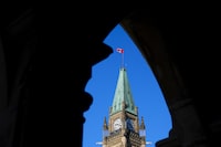 The Canadian flag flies on top of the Peace Tower on Parliament Hill in Ottawa on Monday, March 6, 2023. The federal government is clearing criminal records for people with convictions under indecency and anti-abortion laws by expunging offenses largely directed at the LGBTQ community and women. THE CANADIAN PRESS/Sean Kilpatrick
