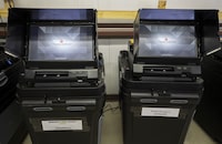 FILE - Dominion Voting ballot-counting machines are shown at a Torrance County warehouse during election equipment testing with local candidates and partisan officers in Estancia, N.M., Sept. 29, 2022. Dominion Voting Systems is suing Fox for $1.6 billion, claiming the news outlet repeatedly aired allegations that the company engaged in fraud that doomed President Donald Trump's re-election campaign while knowing they were untrue. Fox contends that it was reporting newsworthy charges made by supporters of the president and is supported legally by libel standards. The case is scheduled for trial next month. (AP Photo/Andres Leighton, File)