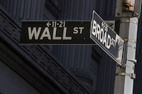 Street signs for Broad St. and Wall St. are seen outside of the New York Stock Exchange (NYSE) in New York, U.S., March 7, 2019.