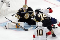 Florida Panthers' Aleksander Barkov (16) scores against Boston Bruins' Jeremy Swayman (1) as Bruins' Jake DeBrusk (74) defends during the third period in Game 4 of an NHL hockey Stanley Cup second-round playoff series, Sunday, May 12, 2024, in Boston. (AP Photo/Michael Dwyer)