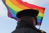 A law enforcement officer stands guard during the LGBT community rally "X St.Petersburg Pride" in central Saint Petersburg, Russia August 3, 2019. REUTERS/Anton Vaganov/File Photo