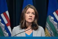 Alberta Premier Danielle Smith answers questions at a news conference in Calgary on Thursday, Feb. 1, 2024. Smith says the province has stepped in to pay an outstanding $25,000 bill to a hotel where a social services agency sent clients in need of support after their discharge from hospital. THE CANADIAN PRESS/Todd Korol