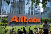 FILE - The logo of Chinese technology firm Alibaba is seen at its office in Beijing on Aug. 10, 2021.  Alibaba Group Holding on Tuesday said it had scrapped plans to list its logistics unit Cainiao in Hong Kong, as it looks to prioritize growing its e-commerce business while facing challenging IPO market conditions. (AP Photo/Mark Schiefelbein, File)