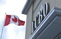 A Canadian flag flies near an under construction LCBO store in Bowmanville, Ont. on Saturday July 20, 2013.<i data-stringify-type="italic" style="box-sizing: inherit; color: rgb(29, 28, 29); font-family: Slack-Lato, Slack-Fractions, appleLogo, sans-serif; font-size: 15px; font-variant-ligatures: common-ligatures; orphans: 2; widows: 2; background-color: rgb(248, 248, 248); text-decoration-thickness: initial;">The Liquor Control Board of Ontario says it will phase out paper bags at its retail stores, a move the provincial agency says will save the equivalent of 188,000 trees each year. THE</i>&nbsp;CANADIAN PRESS/Doug Ives