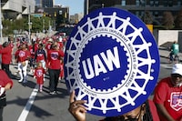 FILE - United Auto Workers members walk in the Labor Day parade, Sept. 2, 2019, in Detroit. The United Auto Workers union announced plans Wednesday, Nov. 29, 2023, to try to simultaneously organize workers at more than a dozen nonunion auto factories. (AP Photo/Paul Sancya, File)
