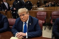 Former U.S. president and Republican presidential candidate Donald Trump sits in court on the first day of opening statements in his trial at Manhattan Criminal Court for falsifying documents related to hush money payments, in New York, U.S. on April 22, 2024.