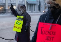 Saskatchewan teachers have withdrawn all volunteer services today as they ramp up an ongoing labour dispute with the province. People march in front of the Midtown Mall during a provincewide, one-day strike organized by members of Saskatchewan Teachers’ Federation in Saskatoon, Sask., Tuesday, Jan. 16, 2024. THE CANADIAN PRESS/Heywood Yu</p>