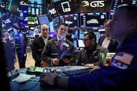 Traders work on the floor at the New York Stock Exchange (NYSE) in New York City, U.S., December 11, 2023.  REUTERS/Brendan McDermid