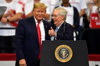 FILE - Then President Donald Trump, left, and Senate Majority Leader Mitch McConnell of Ky., greet each other during a campaign rally in Lexington, Ky., Nov. 4, 2019. McConnell has endorsed Donald Trump for president. McConnell announced his decision after Super Tuesday wins pushed Trump, who is the GOP front-runner, closer to the party nomination. It’s a remarkable turnaround for McConnell, who has blamed Trump for “disgraceful” acts in the Jan. 6, 2021, attack on the Capitol. (AP Photo/Timothy D. Easley, File)