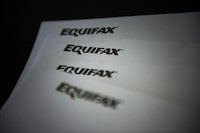 A new survey shows identity and mortgage frauds are at the top of mind for Canadians, Equifax says.Equifax logos are shown on paper in Toronto on Oct.17, 2019. THE CANADIAN PRESS/Christopher Katsarov