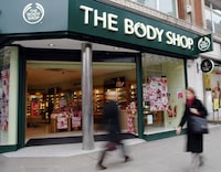 Pedestrians pass a Body Shop cosmetics store in London's Oxford Street in this file photo.