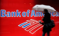 FILE - In this Dec. 7, 2012 photo, a woman passes a Bank of America office branch, in New York.   Bank of America reports earnings on Tuesday, Oct. 17, 2023. (AP Photo/Mark Lennihan, File)