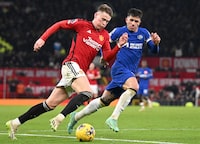 Manchester United's Scottish midfielder #39 Scott McTominay (L) vies with Manchester United's Portuguese midfielder #08 Bruno Fernandes during the English Premier League football match between Manchester United and Chelsea at Old Trafford in Manchester, north west England, on December 6, 2023. Manchester United won the match 2-1. (Photo by Oli SCARFF / AFP) / RESTRICTED TO EDITORIAL USE. No use with unauthorized audio, video, data, fixture lists, club/league logos or 'live' services. Online in-match use limited to 120 images. An additional 40 images may be used in extra time. No video emulation. Social media in-match use limited to 120 images. An additional 40 images may be used in extra time. No use in betting publications, games or single club/league/player publications. /  (Photo by OLI SCARFF/AFP via Getty Images)