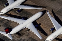 FILE PHOTO: Delta Air Lines passenger planes are seen parked at Birmingham-Shuttlesworth International Airport in Birmingham, Alabama, U.S. March 25, 2020.  REUTERS/Elijah Nouvelage/File Photo