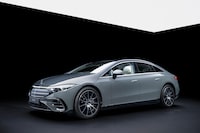 The 2025 Mercedes-Benz EQS sedan features a revised black panel front grille with chrome slats and new bumpers.