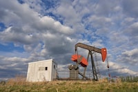 An orphaned well sits in a field near Red Deer, Alberta, Canada, on May 24, 2023. Activists and experts say the existence of these inactive oil and gas installations -- often dug hundreds of meters (yards) below the surface in Alberta province -- is a ticking ecological time bomb for the vast country. (Photo by Geoff Robins / AFP) (Photo by GEOFF ROBINS/AFP via Getty Images)