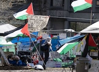 A new online opinion poll suggests that nearly half of Canadians oppose the pro-Palestinian encampments that have cropped up on a number of university campuses across the country. Pro-Palestinian activists at their encampment on McGill University campus, in Montreal, Monday, May 6, 2024. THE CANADIAN PRESS/Ryan Remiorz