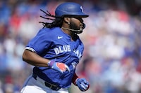 Toronto Blue Jays' Vladimir Guerrero Jr. watches a fly ball in the fourth inning of a spring training baseball game against the Philadelphia Phillies Monday, March 4, 2024, in Dunedin, Fla. (AP Photo/Charlie Neibergall)
