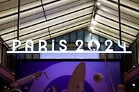 FILE PHOTO: The logo of the Paris 2024 Olympic and Paralympic Games is seen on an official Paris 2024 store in Paris, France, February 8, 2024. REUTERS/Benoit Tessier/File Photo