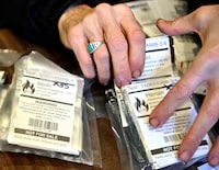 Dave Hamm, an ethical substance peer navigator with the Vancouver Area Network of Drug Users (VANDU), distributes packets of drugs tested for contaminants, as the province of British Columbia decriminalized the possession of small amounts of cocaine, methamphetamine, MDMA and opioids like heroin, fentanyl and morphine, in the Downtown Eastside of Vancouver, British Columbia, Canada January 31, 2023. REUTERS/Jennifer Gauthier