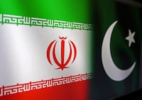 FILE PHOTO: Iranian and Pakistani flags are seen in this illustration taken, January 18, 2024. REUTERS/Dado Ruvic/Illustration/File Photo