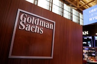 FILE PHOTO: The logo for Goldman Sachs is seen on the trading floor at the New York Stock Exchange (NYSE) in New York City, New York, U.S., November 17, 2021. REUTERS/Andrew Kelly//File Photo