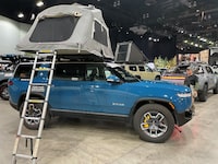 Camping accessories on the Rivian R1S SUV on display at the 2023 AutoMobility LA auto show in Los Angeles.