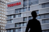FILE PHOTO: The logo of Toshiba Corp is displayed at the company's building in Kawasaki, Japan, April 5, 2023. REUTERS/Androniki Christodoulou/File Photo
