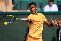 Canada's Felix Auger-Aliassime plays a forehand return to Italy's Luca Nardi during their Monte Carlo ATP Masters Series Tournament round of 64 tennis match on the Rainier III court at the Monte Carlo Country Club on April 8, 2024. (Photo by Valery HACHE / AFP) (Photo by VALERY HACHE/AFP via Getty Images)