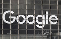 FILE PHOTO: The logo of Google is seen on a building at la Defense business and financial district in Courbevoie near Paris, France, September 1, 2020.  REUTERS/Charles Platiau/File Photo