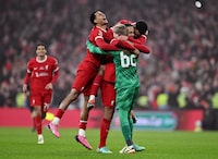 LONDON, ENGLAND - FEBRUARY 25: Cody Gakpo, Virgil van Dijk and Caoimhin Kelleher of Liverpool celebrate after the team's victory in the Carabao Cup Final match between Chelsea and Liverpool at Wembley Stadium on February 25, 2024 in London, England. (Photo by Mike Hewitt/Getty Images)
