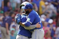 Toronto Blue Jays' Jay Jackson, front, celebrates with Alejandro Kirk, behind, after defeating the Boston Red Sox in a baseball game, Sunday, Aug. 6, 2023, in Boston. (AP Photo/Steven Senne)