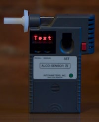 A Quebec coroner is recommending the province look at reducing the blood- alcohol limit in the province to .05, but Quebec's transport minister says lowering the limit is not in the plans. A police hand-held breathalyzer is shown in Vancouver, B.C., Wednesday, Dec. 21, 2011. THE CANADIAN PRESS/Jonathan Hayward