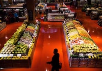 A group of leaders in the agriculture and food industries is launching a national alliance to work toward achieving net zero in Canada's agri-food sector by 2050. People shop in the produce area at a Loblaws store in Toronto on May 3, 2018. THE CANADIAN PRESS/Nathan Denette