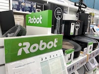 LARKSPUR, CALIFORNIA - AUGUST 05: Roomba robot vacuums made by iRobot are displayed on a shelf at a Bed Bath and Beyond store on August 05, 2022 in Larkspur, California. Amazon announced plans to purchase iRobot, maker of the popular robotic vacuum Roomba, for an estimated $1.7 billion. (Photo by Justin Sullivan/Getty Images)