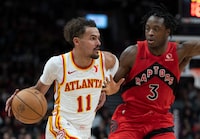 Atlanta Hawks guard Trae Young (11) drives past Toronto Raptors forward OG Anunoby (3) during second half NBA action in Toronto, Wednesday, Dec. 13, 2023. Anunoby, the backbone of Toronto's defence, said that speaking up is about being a second pair of eyes for his teammates.THE CANADIAN PRESS/Frank Gunn