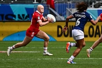 Canada's Olivia Apps (L) carries the ball during the France vs Canada match in the 2024 HSBC Rugby Sevens LA women's tournament at Dignity Health Sports Park in Carson, California on March 3, 2024. (Photo by Patrick T. Fallon / AFP) (Photo by PATRICK T. FALLON/AFP via Getty Images)