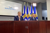 Nova Scotia Liberal MLA Brendan Maguire has crossed the floor to the join the Progressive Conservatives. Nova Scotia Premier Tim Houston, left, takes part in a press conference with Maguire, in Halifax, Thursday, Feb. 22, 2024. THE CANADIAN PRESS/Keith Doucette
