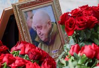 A view shows a framed photo of Russian mercenary chief Yevgeny Prigozhin at his grave at the Porokhovskoye cemetery in Saint Petersburg, Russia, August 30, 2023. REUTERS/Stringer/File Photo