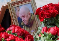 A view shows a framed photo of Russian mercenary chief Yevgeny Prigozhin at his grave at the Porokhovskoye cemetery in Saint Petersburg, Russia, August 30, 2023. REUTERS/Stringer/File Photo