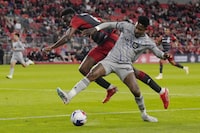 Toronto FC's Aime Mabika, left, battles for the ball with CF Montreal's Romell Quioto during second half Canadian Championship quarterfinal soccer action in Toronto on Tuesday, May 9, 2023.THE CANADIAN PRESS/Chris Young